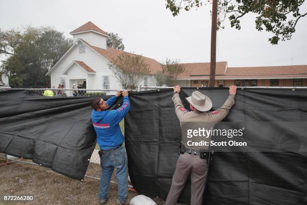 Tarp is wrapped around the First Baptist Church of Sutherland Springs as law enforcement officials wrap up their investigation into the shooting on...