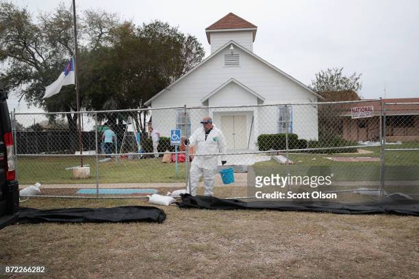 Workers patch bullet holes and paint the exterior of the First Baptist Church of Sutherland Springs on November 9, 2017 in Sutherland Springs, Texas....