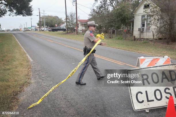 Police remove a road block as they begin to wrap up their investigation of the shooting at the First Baptist Church of Sutherland Springs on November...