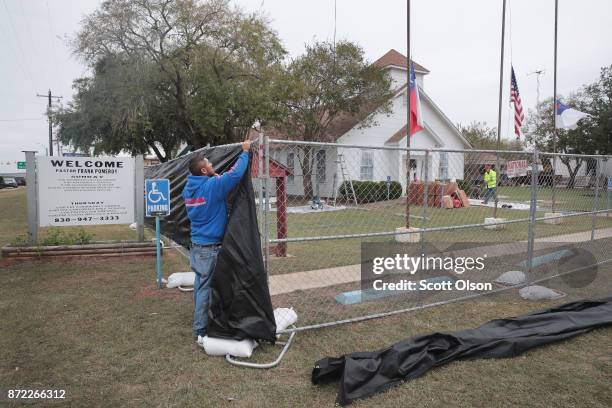 Tarp is wrapped around the First Baptist Church of Sutherland Springs as law enforcement officials wrap up their investigation into the shooting on...