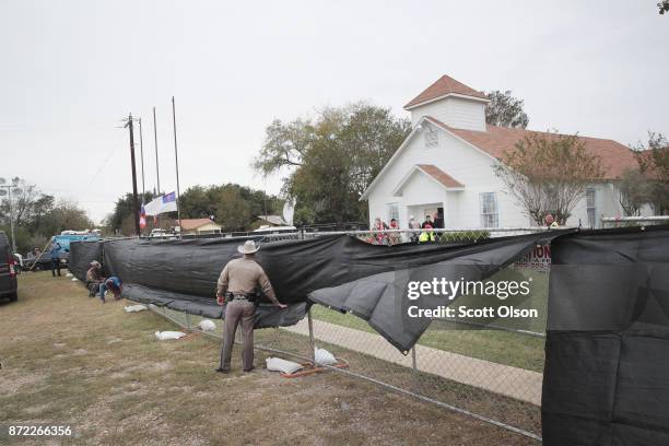 Tarp is wrapped around the First Baptist Church of Sutherland Springs as law enforcement officials wrap up their investigation into the shooting on...