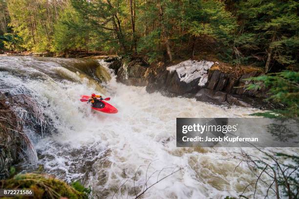 whitewater kayaking on a river in the spring - wildwasser fluss stock-fotos und bilder