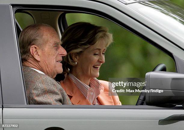 Prince Philip, The Duke of Edinburgh, and Lady Penny Brabourne watch the driven dressage from the Prince's Landrover during day three of the Royal...