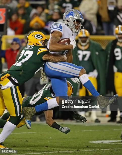 Marvin Jones of the Detroit Lions is hit by Josh Jones and Kevin King of the Green Bay Packers at Lambeau Field on September 28, 2017 in Green Bay,...