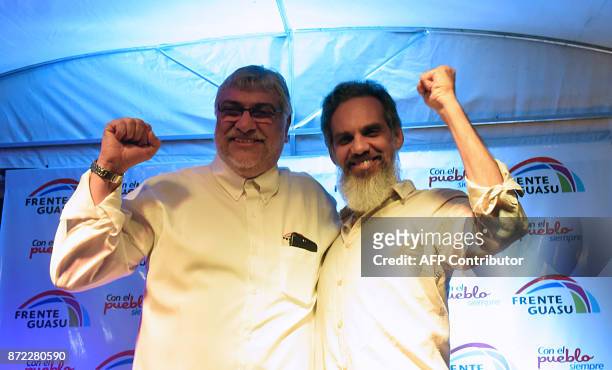 Former Paraguayan president Fernando Lugo and journalist Leonardo Rubin gesture during the launch of their election campaign in Asuncion on November...