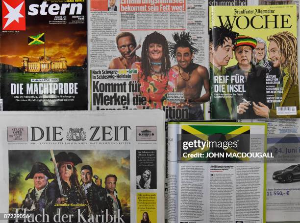 Picture taken on November 9, 2017 showing caricatures and altered photographs in German newspapers and magazines poking fun at the so-called "Jamaica...