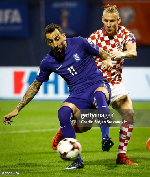 Kostas Mitroglou of Greece in action against Domagoj Vida of Croatia during the FIFA 2018 World Cup Qualifier Play-Off: First Leg between Croatia and...