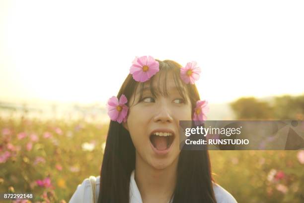 happy young woman with flowers in her hair - adorno floral fotografías e imágenes de stock