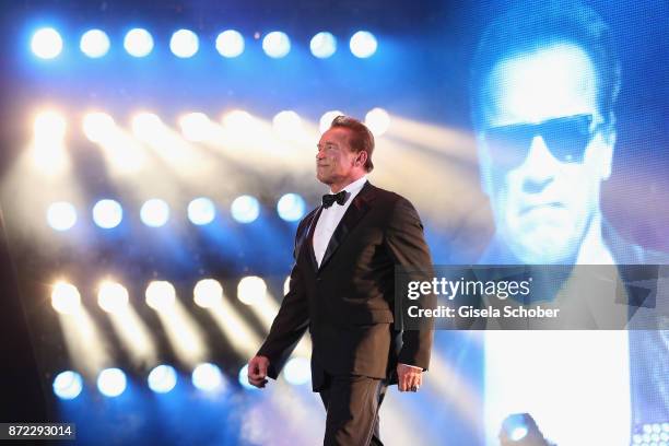 Legend of the Century" GQ Man of the year Arnold Schwarzenegger is seen on stage at the GQ Men of the year Award 2017 show at Komische Oper on...