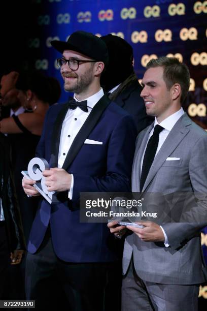 Men of the year Mark Forster and Philipp Lahm are seen at the end of the GQ Men of the year Award 2017 show at Komische Oper on November 9, 2017 in...
