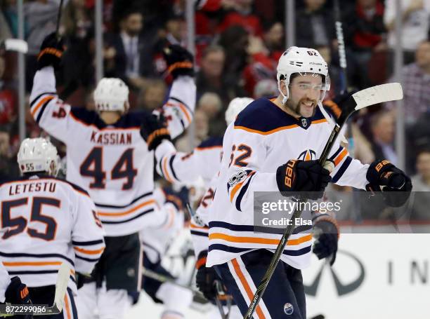 Eric Gryba of the Edmonton Oilers and the rest of the bench celebrates teammate Leon Draisaitl's game winning goal in overtime against the New Jersey...