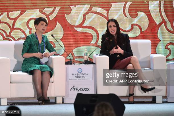 New Zealand's Prime Minister Jacinda Ardern speaks with session moderator Tian Wei on the final day of the APEC CEO Summit, part of the broader...