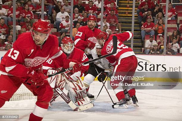 Detroit Red Wings goalie Chris Osgood , Brad Stuart , and Niklas Kronwall in action vs Anaheim Ducks Todd Marchant . Game 2. Detroit, MI 5/3/2009...