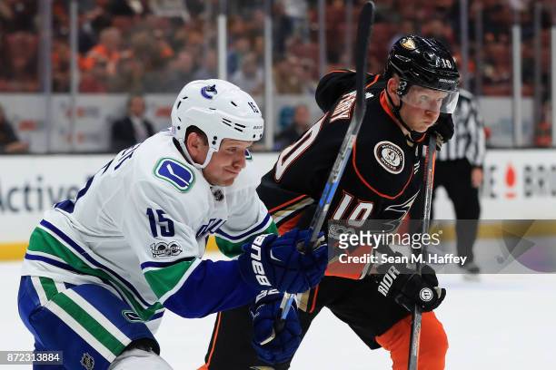 Derek Dorsett of the Vancouver Canucks pushes Corey Perry of the Anaheim Ducks during the first period of a game at Honda Center on November 9, 2017...