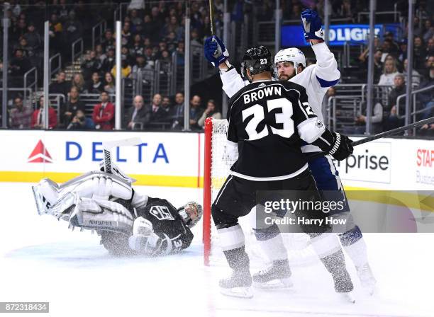 Nikita Kucherov of the Tampa Bay Lightning celebrates his goal in front of Dustin Brown and Jonathan Quick of the Los Angeles Kings to take a 1-0...