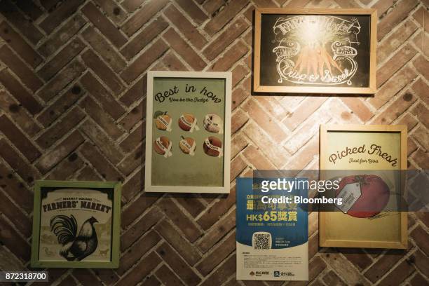 An advertisement for Ant Financial Services Group's Alipay, an affiliate of Alibaba Group Holding Ltd., bottom second right, is displayed next to art...