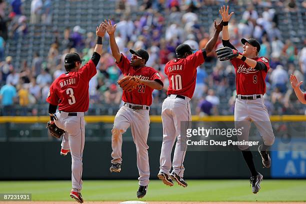 Kazuo Matsui, Michael Bourn, Miguel Tejada and Hunter Pence of the Houston Astros celebrate after defeating the Colorado Rockies during MLB action at...