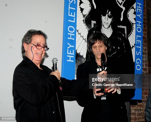 Danny Fields presents Mickey Lee, Joey Ramones' brother, with Joey Ramones' Hall of Fame induction statue at an induction award at the Rock & Roll...