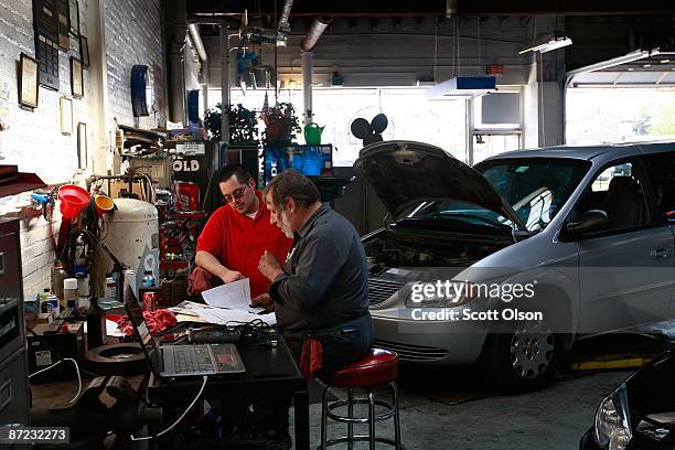 Anthony Flores and Larry Noga work in the service department at the Balzekas Chrysler dealership May 14, 2009 in Chicago, Illinois. The dealership,...