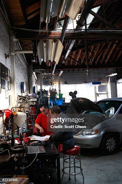 Anthony Flores and Larry Noga work in the service department at the Balzekas Chrysler dealership May 14, 2009 in Chicago, Illinois. The dealership,...