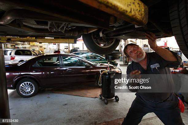 Larry Noga works on a vehicle in the service department at the Balzekas Chrysler dealership May 14, 2009 in Chicago, Illinois. The dealership, which...