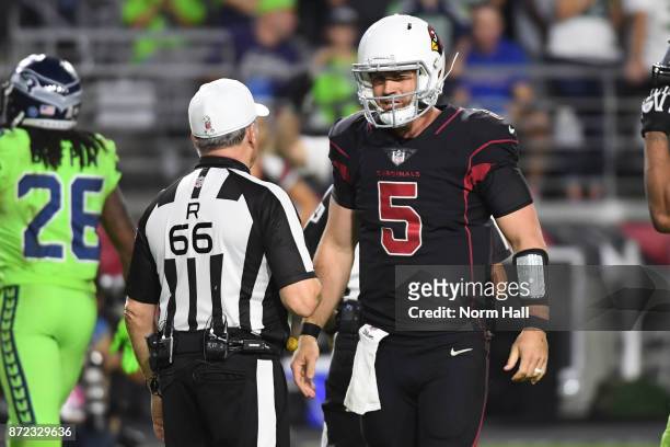 Quarterback Drew Stanton of the Arizona Cardinals talks with referee Walt Anderson after a play in the second half against the Seattle Seahawks at...