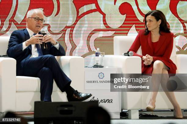 Malcolm Turnbull, Australia's prime minister, left, speaks as Sheryl Sandberg, chief operating officer of Facebook Inc., looks on during the...