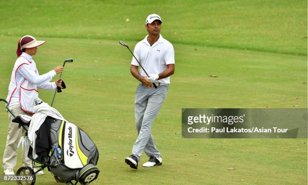 Jyoti Randhawa of India plays a shot during round two of the Resorts World Manila Masters at Manila Southwoods Golf and Country Club on November 10,...