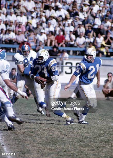 Quarterback John Hadl hands off to running back Paul Lowe of the San Diego Chargers in a 31 to 14 win over the Houston Oilers on October 3, 1965 at...