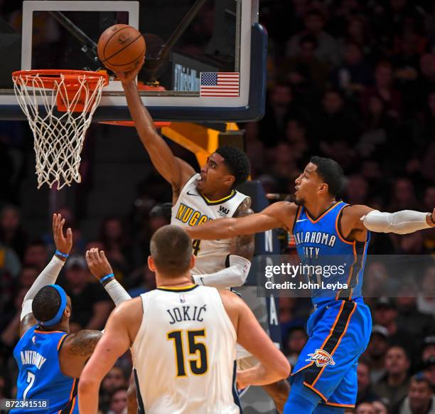 Denver Nuggets guard Gary Harris goes up for a bucket past Oklahoma City Thunder guard Andre Roberson during the third quarter on November 9, 2017 in...