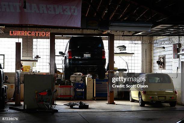 Cars sit in servce bays at Balzekas Chrysler dealership May 14, 2009 in Chicago, Illinois. The dealership, which has been in business since 1919 and...
