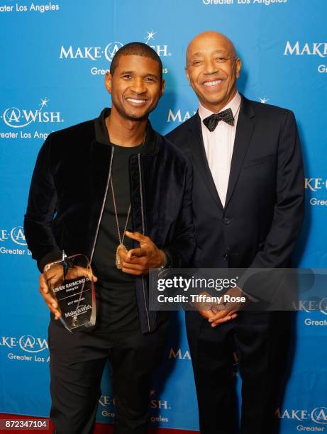 Shining Star award recipient Usher Raymond IV and music producer Russell Simmons at the 2017 Make a Wish Gala on November 9, 2017 in Los Angeles,...