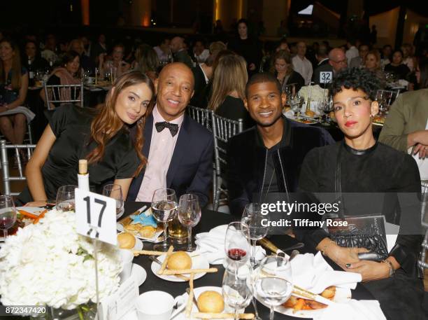 Music producer Russell Simmons , singer-songwriter Usher Raymond IV and Grace Miguel at the 2017 Make a Wish Gala on November 9, 2017 in Los Angeles,...