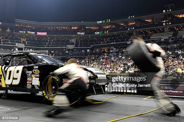 Crew members compete during the NASCAR Sprint Pit Crew Challenge on May 14, 2009 at Time Warner Cable Arena in Charlotte, North Carolina.