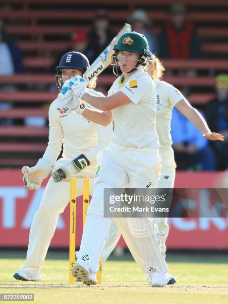 Beth Mooney of Australia hits to deep mid wicket and is caught by Natalie Sciver off the bowling of Sophie Ecclestone during day two of the Women's...