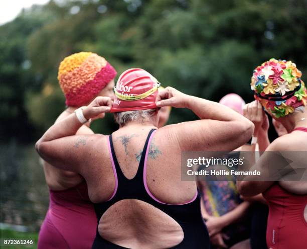 wild swimming women's group autumnal swim - old woman tattoos stock pictures, royalty-free photos & images