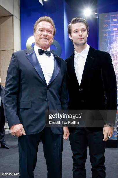 Actor Arnold Schwarzenegger and his son Patrick Schwarzenegger arrive for the GQ Men of the year Award 2017 at Komische Oper on November 9, 2017 in...