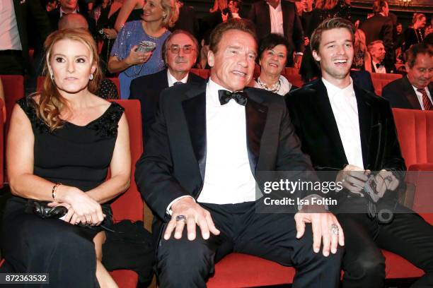 Actor Arnold Schwarzenegger with his partner Heather Milligan and his son Patrick Schwarzenegger during the GQ Men of the year Award 2017 show at...