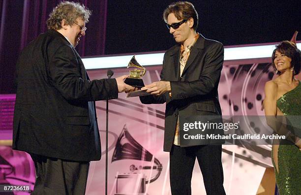 Mike Guzauski, winner of Best Engineered Album, Non-Classical, for "Back Home" by Eric Clapton, with presenters Steve Vai and Giselle Fernandez