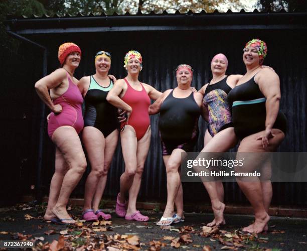 wild swimming women's group autumnal swim - old woman in swimsuit imagens e fotografias de stock