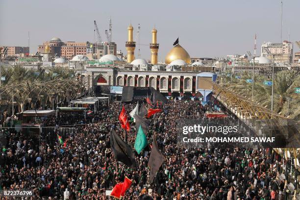 Picture taken on November 10, 2017 shows Shiite pilgrims gathering in front of the Immam Hussein shrine in the southern Iraqi city of Karbala for the...