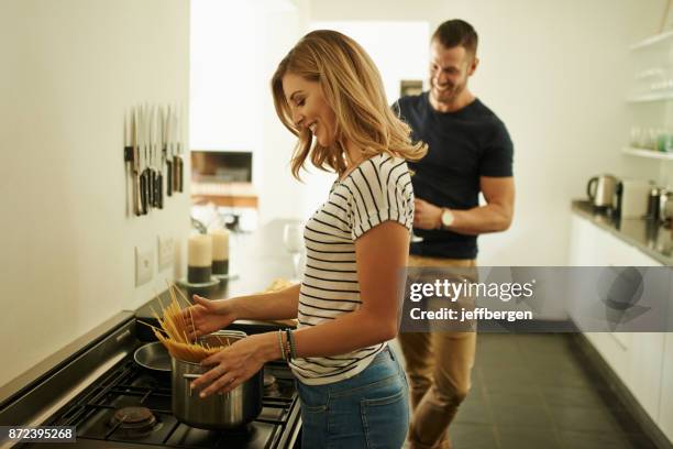 cooking my babe's favorite meal - boiling pasta stock pictures, royalty-free photos & images