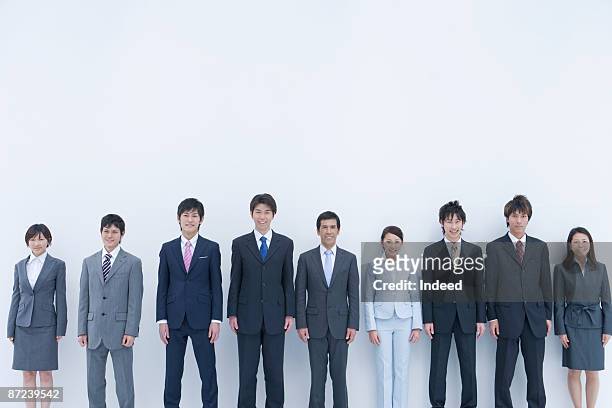 businessman and woman standing in a raw, portrait - only japanese stock pictures, royalty-free photos & images