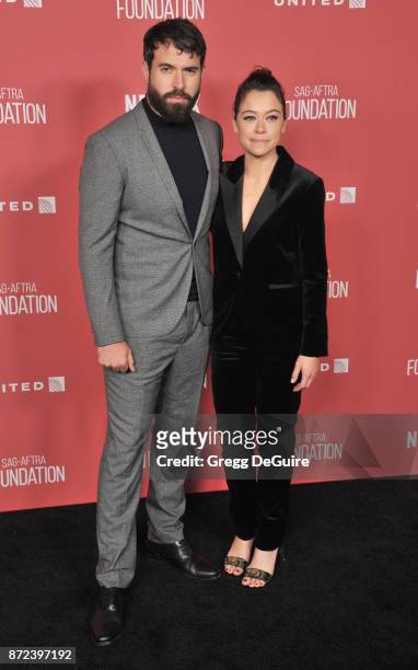 Tatiana Maslany and Tom Cullen arrive at the SAG-AFTRA Foundation Patron of the Artists Awards 2017 on November 9, 2017 in Beverly Hills, California.