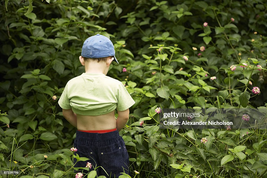 Young boy relieving himself