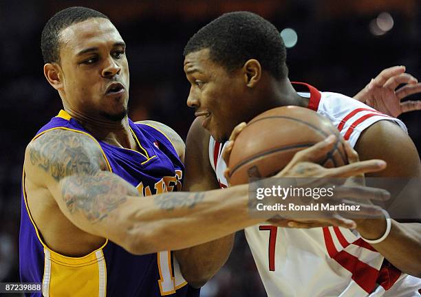 Guard Shannon Brown of the Los Angeles Lakers challenges Kyle Lowry of the Houston Rockets in Game Six of the Western Conference Semifinals during...