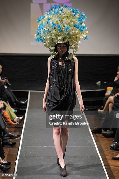 Model walks the runway wearing Form New York in collaboration with Preston Bailey at the 8th annual Tulips & Pansies: A Headdress Affair at The...