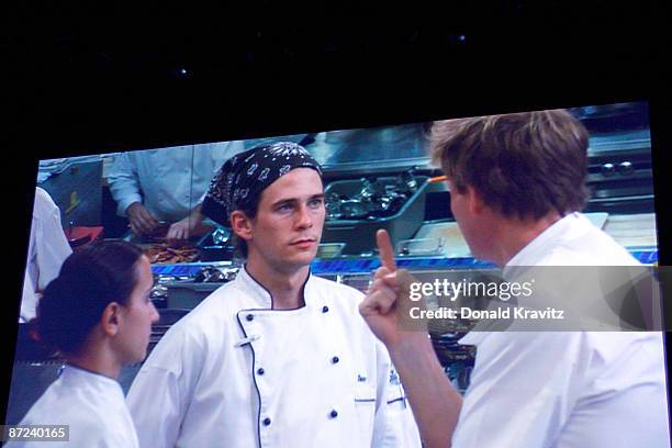 Chef Paula DaSilva and Winner Danny Veltri listen to Host Gordon Ramsay as they appear on a large screen set up for the audience attending the...