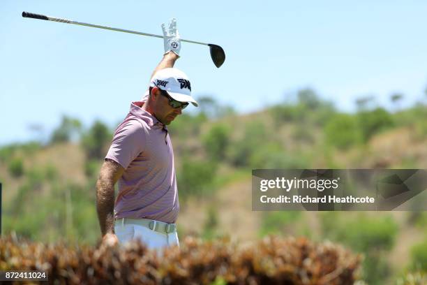 Charl Schwartzel of South Africa reacts to a tee shot on the 5th hole during the second round of the Nedbank Golf Challenge at Gary Player CC on...