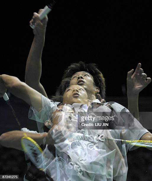 The multiple exposure photo shows Thailand's Boonsak Ponsana returning a shuttlecock to Russia's Stanislav Pukhov during the men's singles play-off...